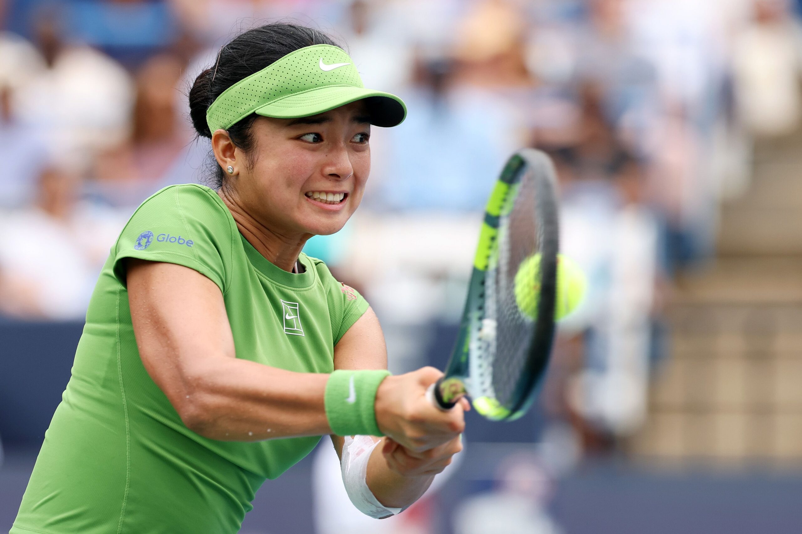 <i>Emilee Chinn/Getty Images via CNN Newsource</i><br/>Alexandra Eala of the Philippines returns a shot during the women's singles championship match against Jessica Pegula in Washington