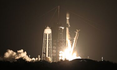 The SpaceX Falcon 9 rocket is seen arcing over the sky after liftoff in 2025.
