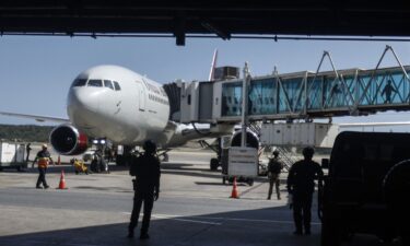 Venezuelan migrants repatriated from the US walk upon arrival at Simon Bolivar International Airport in Maiquetia