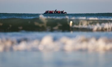 Migrants on an inflatable dinghy leave the coast of northern France in an attempt to cross the English Channel to reach Britain