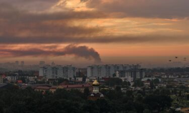 An aerial view shows a fire burning at a logistics warehouse on the outskirts of Kyiv following a Russian ballistic missile attack in Kyiv