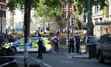 Police Officers stand at a cordon near the Shaftesbury Theatre