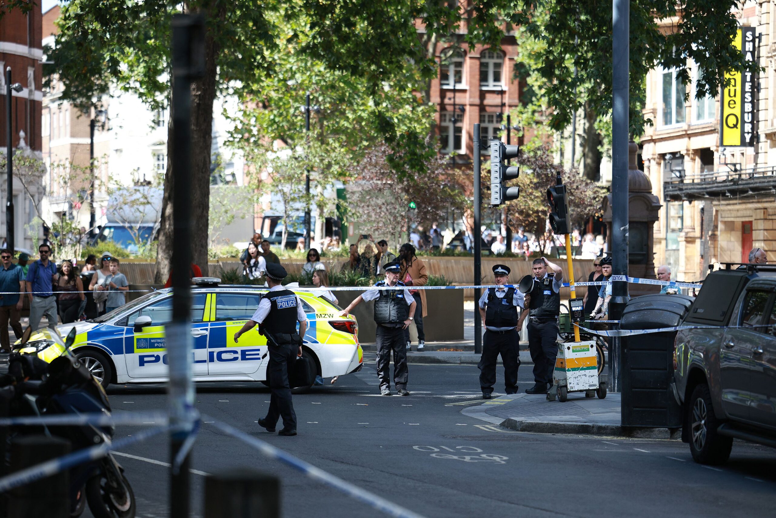 <i>Henry Nicholls/AFP/Getty Images via CNN Newsource</i><br/>Police Officers stand at a cordon near the Shaftesbury Theatre