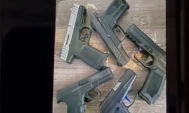 This image of five guns was taken from one of the defendant's cell phones