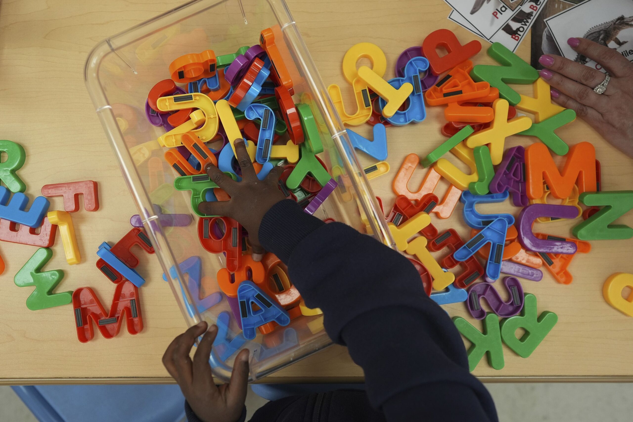 <i>Rebecca Blackwell/AP via CNN Newsource</i><br/>A student looks for a certain letter during a reading and writing lesson at a Head Start program run by Easterseals