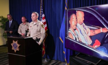 Prosecutors announced charges against Duane Davis in September 2023 next to an image of Tupac Shakur (left) and Marion "Suge" Knight in a car in Las Vegas the night Tupac was killed.