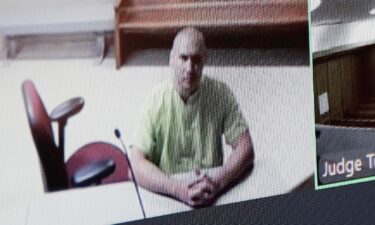 Arson suspect Aaron Farinacci waits for his initial court appearance by video at the county courthouse in Spokane