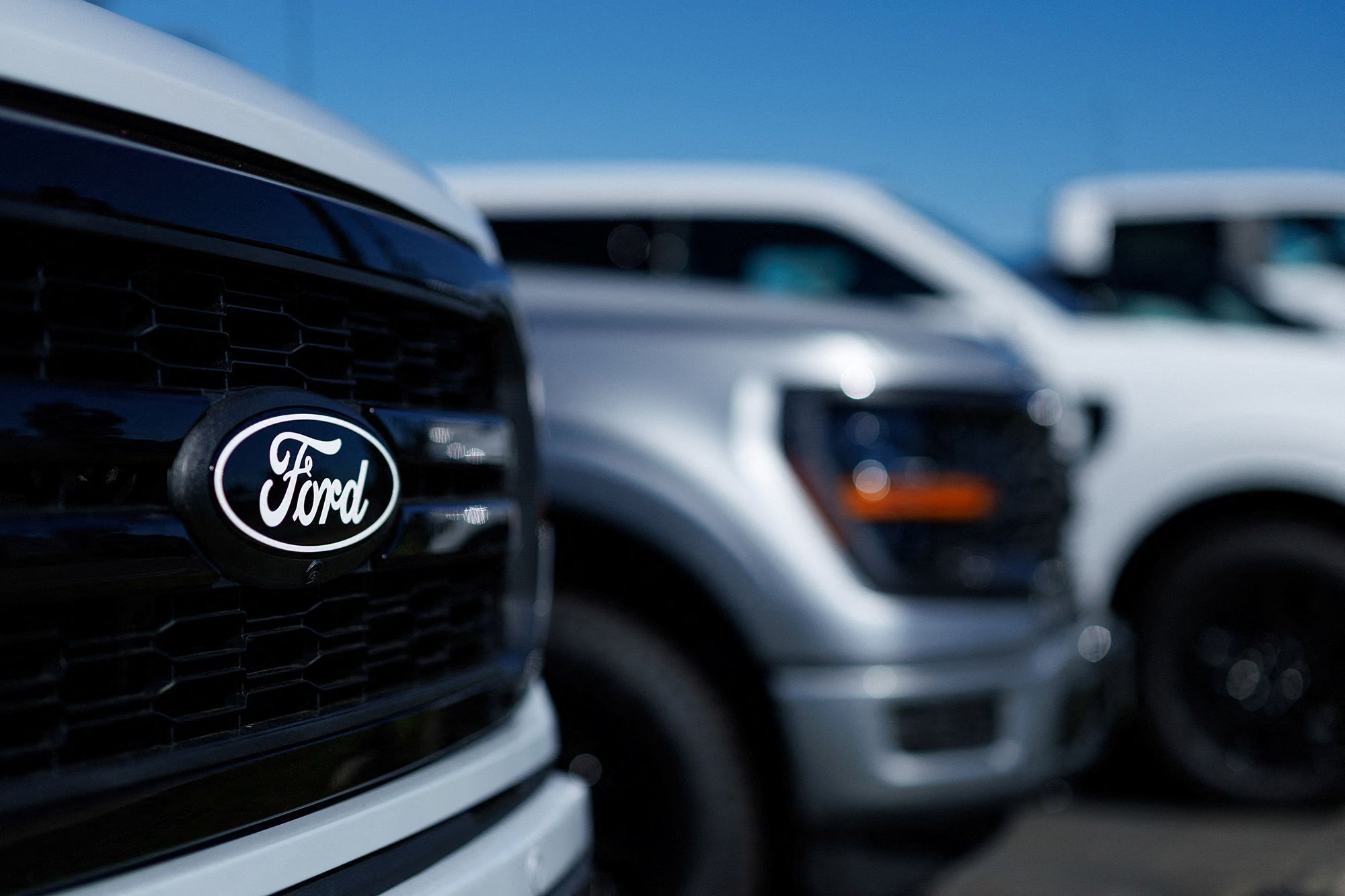 <i>Mike Blake/Reuters via CNN Newsource</i><br/>Ford F-150 pickup trucks for sale in Encinitas