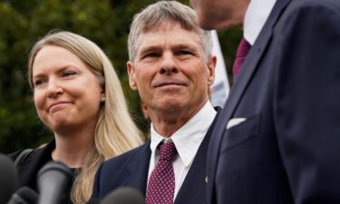 Former US Olympic canoeist David Hearn stands with his lawyer at DC Superior Court in Washington