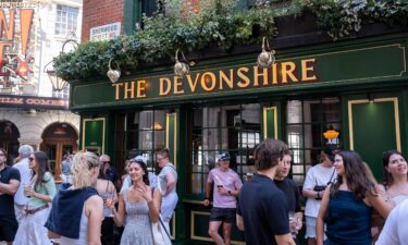 People standing around outside pubs with drinks is a familiar feature of the British summer.