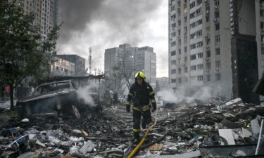 A rescuer worker walks through the rubble of a multi-story residential building damaged in a Russian ballistic missile strike in the Ukrainian capital of Kyiv on July 6.
