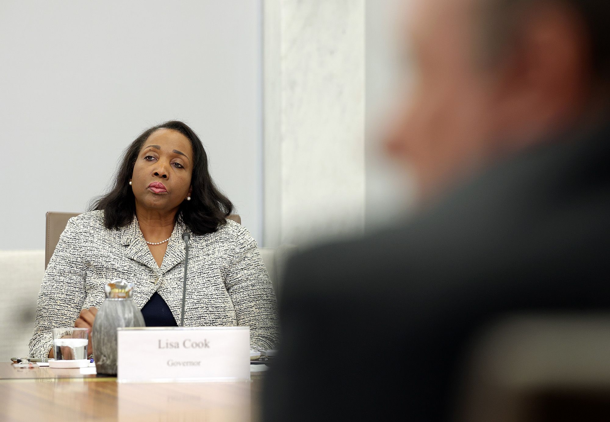 <i>Kevin Dietsch/Getty Images via CNN Newsource</i><br/>Federal Reserve Board Governor Lisa Cook participates in a board meeting at the Federal Reserve on March 19 in Washington