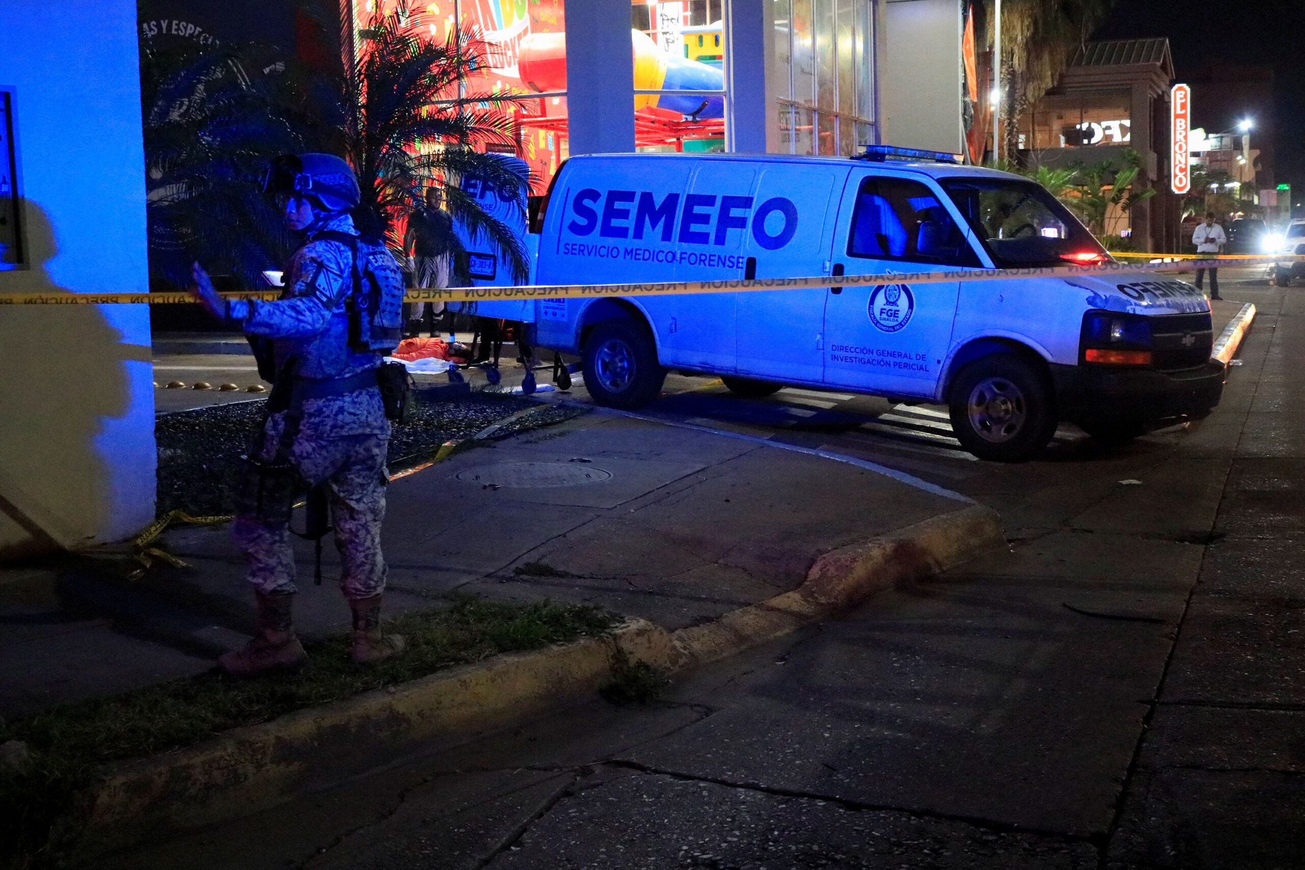 <i>Jesus Bustamante/Reuters via CNN Newsource</i><br/>A soldier stands guard as forensic technicians and police officers work at the crime scene where Mexican social media influencer Cesar Gastelum