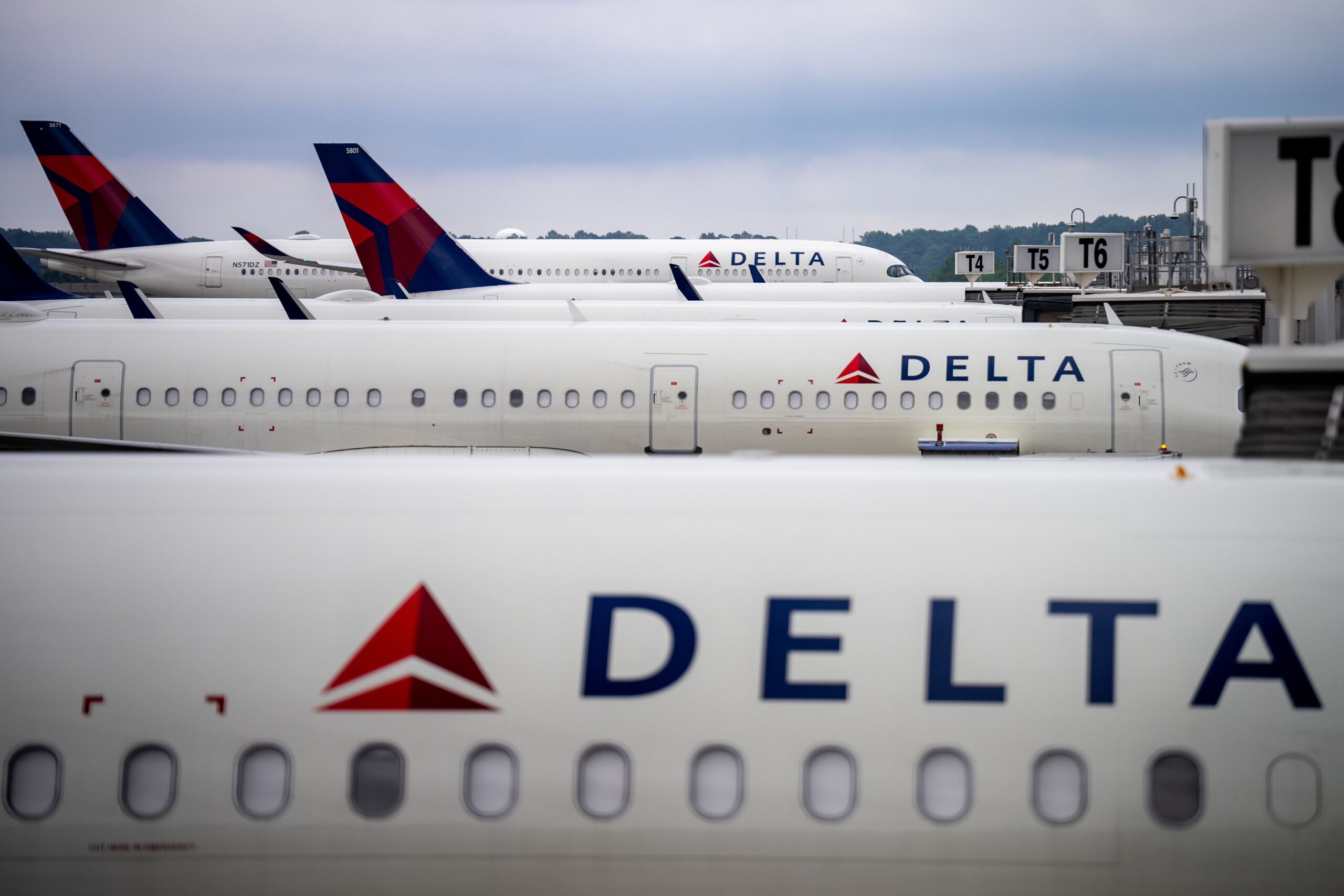 <i>Andrew Harnik/Getty Images via CNN Newsource</i><br/>Delta Air Lines planes sit parked at Hartsfield-Jackson Atlanta International Airport on June 28