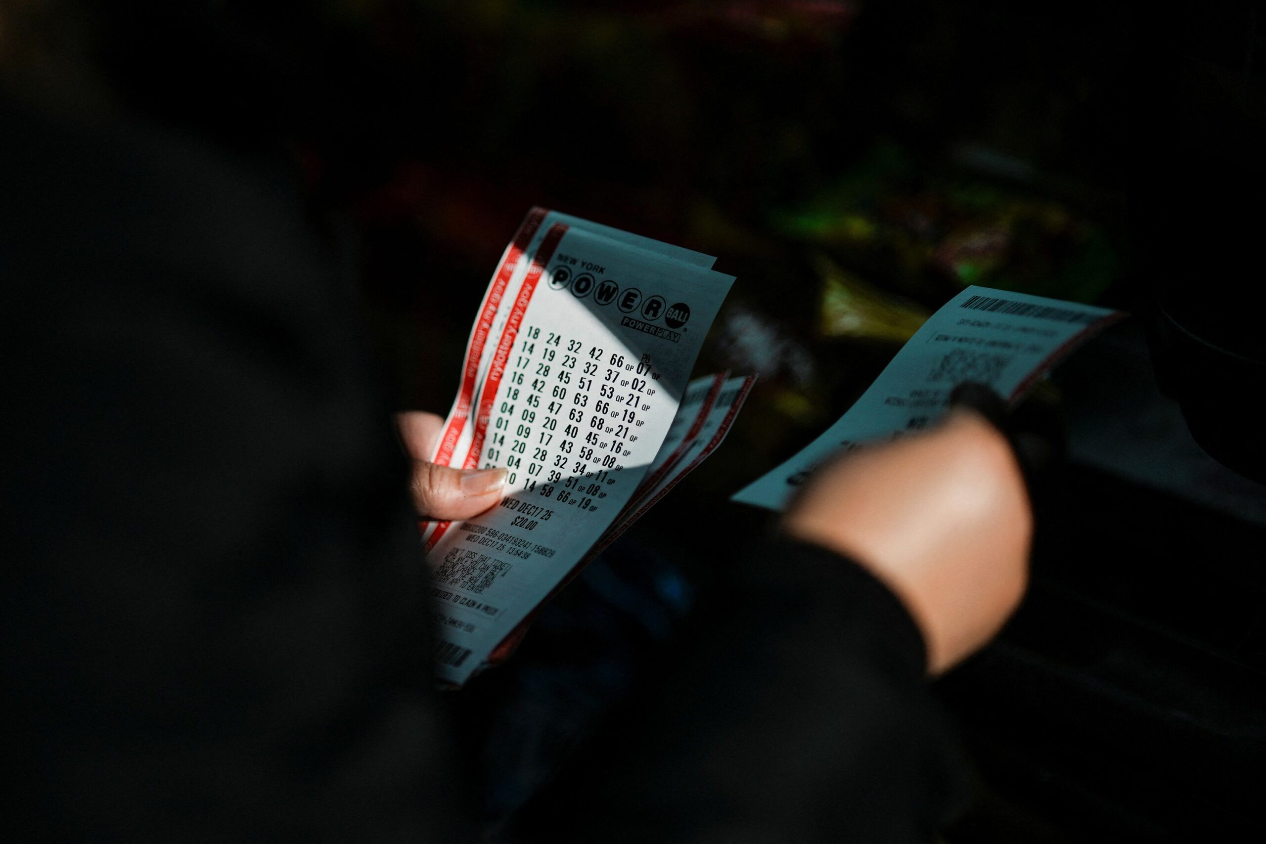 <i>Eduardo Munoz/Reuters via CNN Newsource</i><br/>A person holds tickets for the $1.25 billion jackpot in the Powerball lottery drawing in New York