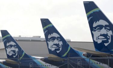 The Alaska Airlines logo is displayed on the tail section of Alaska Airlines planes at San Francisco International Airport on January 25