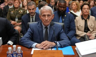 Sen. Ron Johnson speaks to  Sen. Rand Paul as Dr. Anthony Fauci testifies before the Senate Homeland Security and Governmental Affairs Committee hearing in Washington