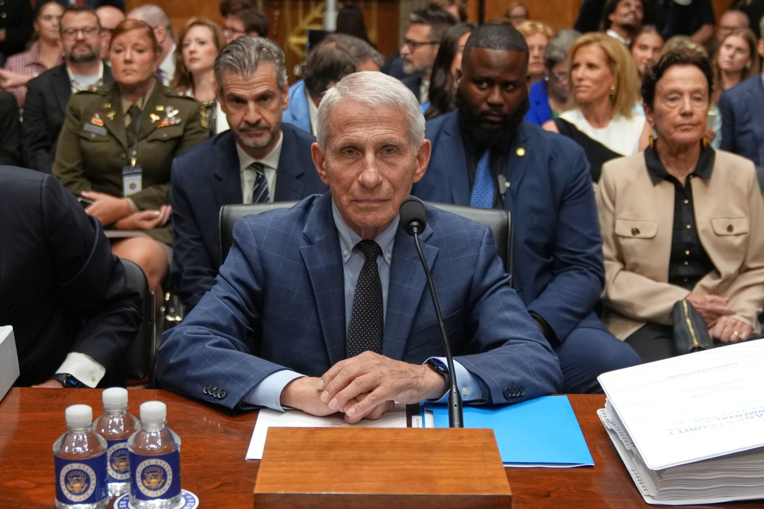<i>Kevin Dietsch/Getty Images via CNN Newsource</i><br/>Sen. Ron Johnson speaks to  Sen. Rand Paul as Dr. Anthony Fauci testifies before the Senate Homeland Security and Governmental Affairs Committee hearing in Washington