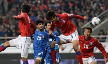 Kwak Tae-Hwi of South Korea and Mesaed Enzi of Kuwait compete for the ball during the 2014 FIFA World Cup Brazil Asian 3rd Qualifier match between South Korea and Kuwait at Seoul Worldcup Stadium in Seoul