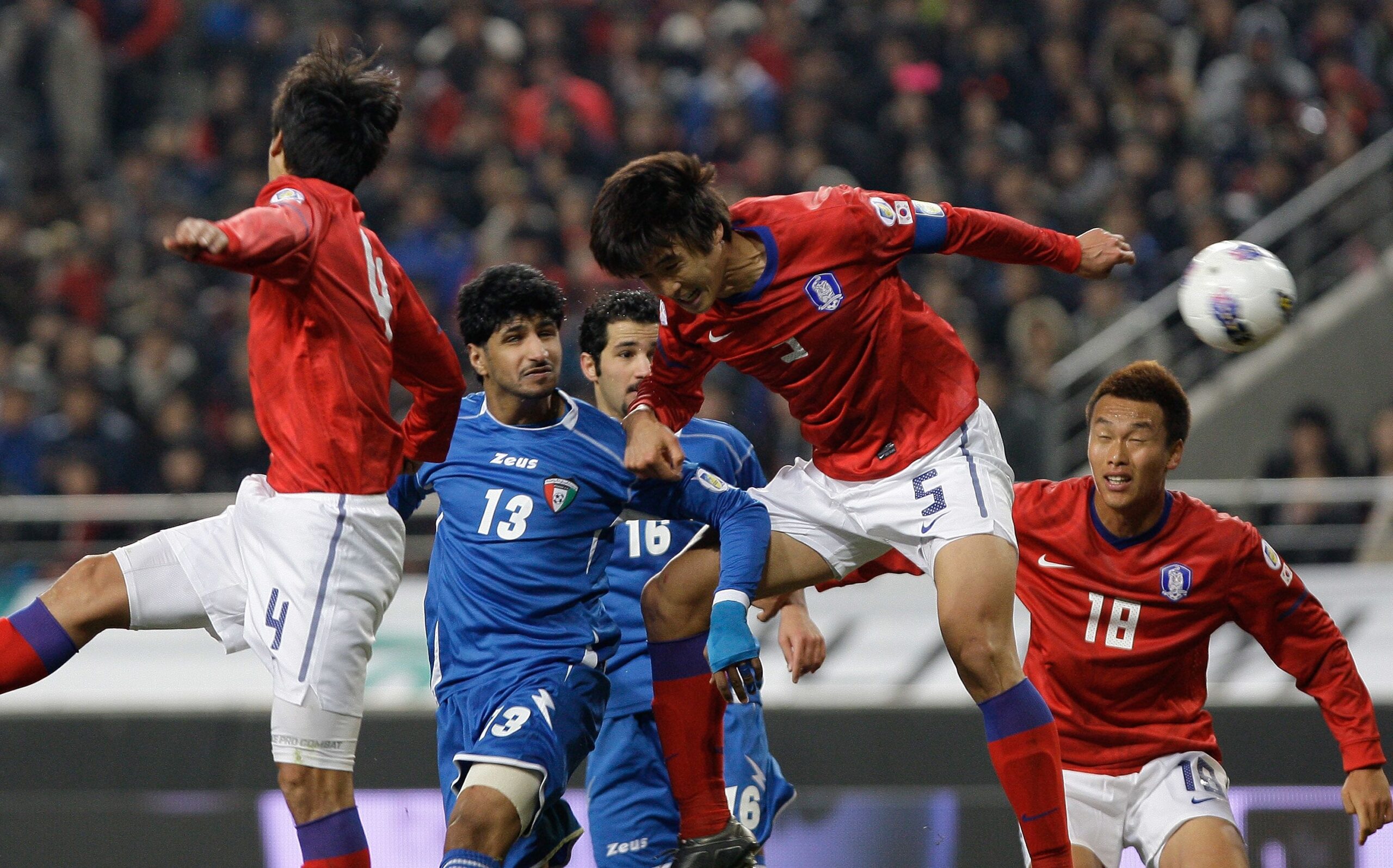 <i>Chung Sung-Jun/Getty Images via CNN Newsource</i><br/>Kwak Tae-Hwi of South Korea and Mesaed Enzi of Kuwait compete for the ball during the 2014 FIFA World Cup Brazil Asian 3rd Qualifier match between South Korea and Kuwait at Seoul Worldcup Stadium in Seoul