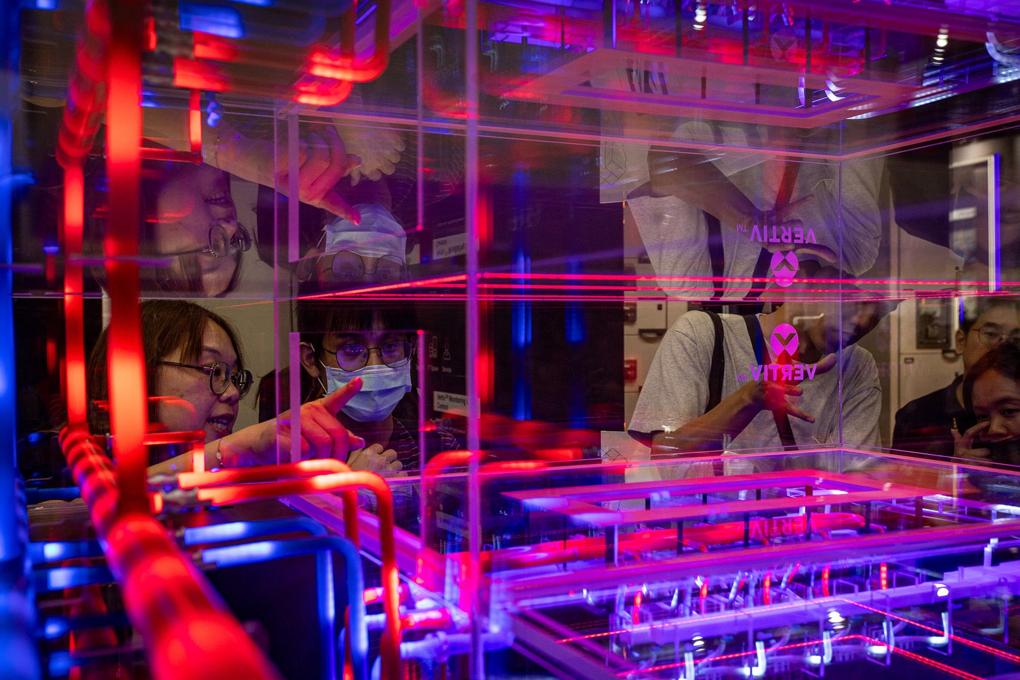 <i>Cheng Chia Huang/Getty Images via CNN Newsource</i><br/>The reflection of attendees is seen on a glass window showcasing GIGABYTE server racks at a booth during COMPUTEX on June 02