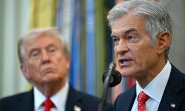 President Donald Trump listens to Medicare and Medicaid Administrator Dr. Mehmet Oz during an announcement in the Oval Office on October 16