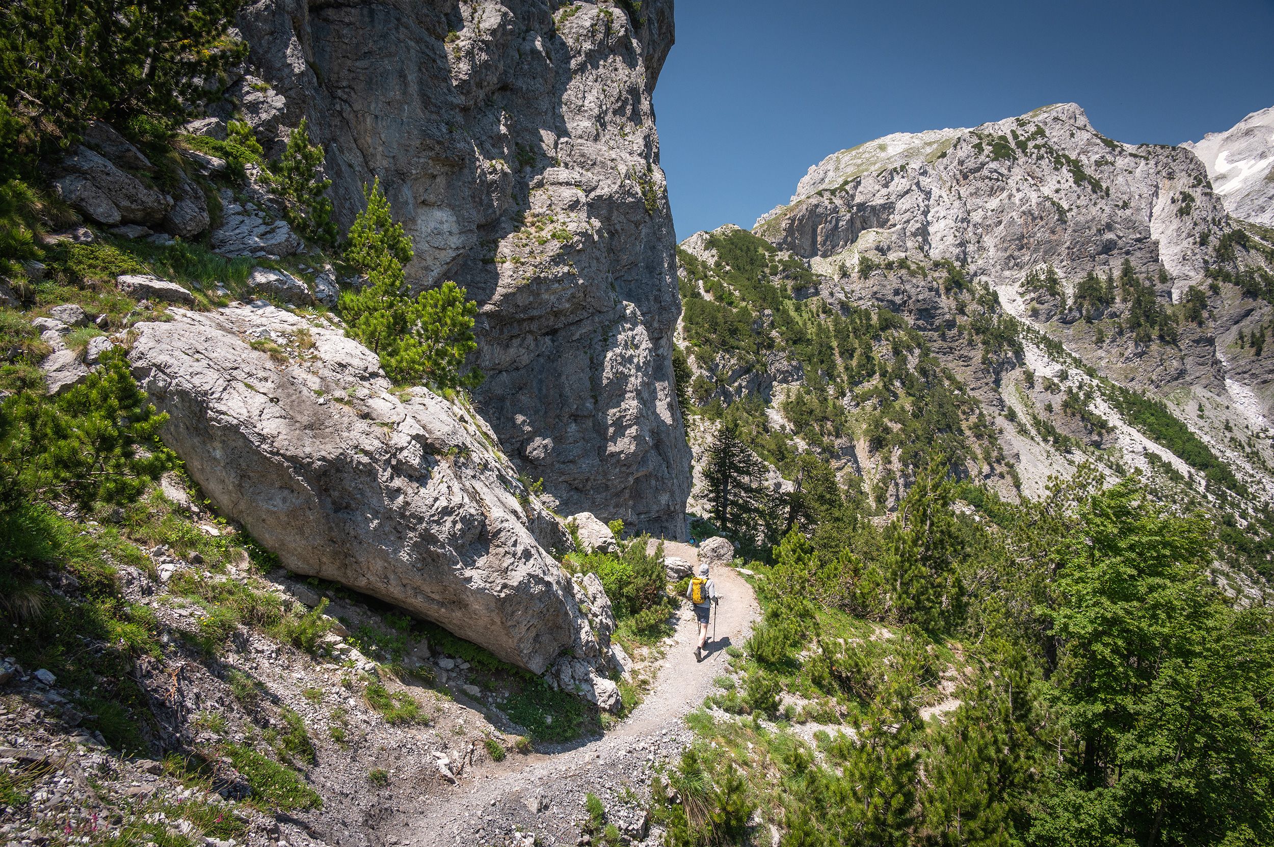 <i>Marc Guitard/Moment Unreleased RF/Getty Images via CNN Newsource</i><br/>A hiker descends from the Valbona Pass along the Peaks of the Balkans Trail. The Peaks of the Balkans hiking trail is a challenging yet incredibly rewarding long-distance trek that winds through the remote and spectacular Accursed Mountains of Albania