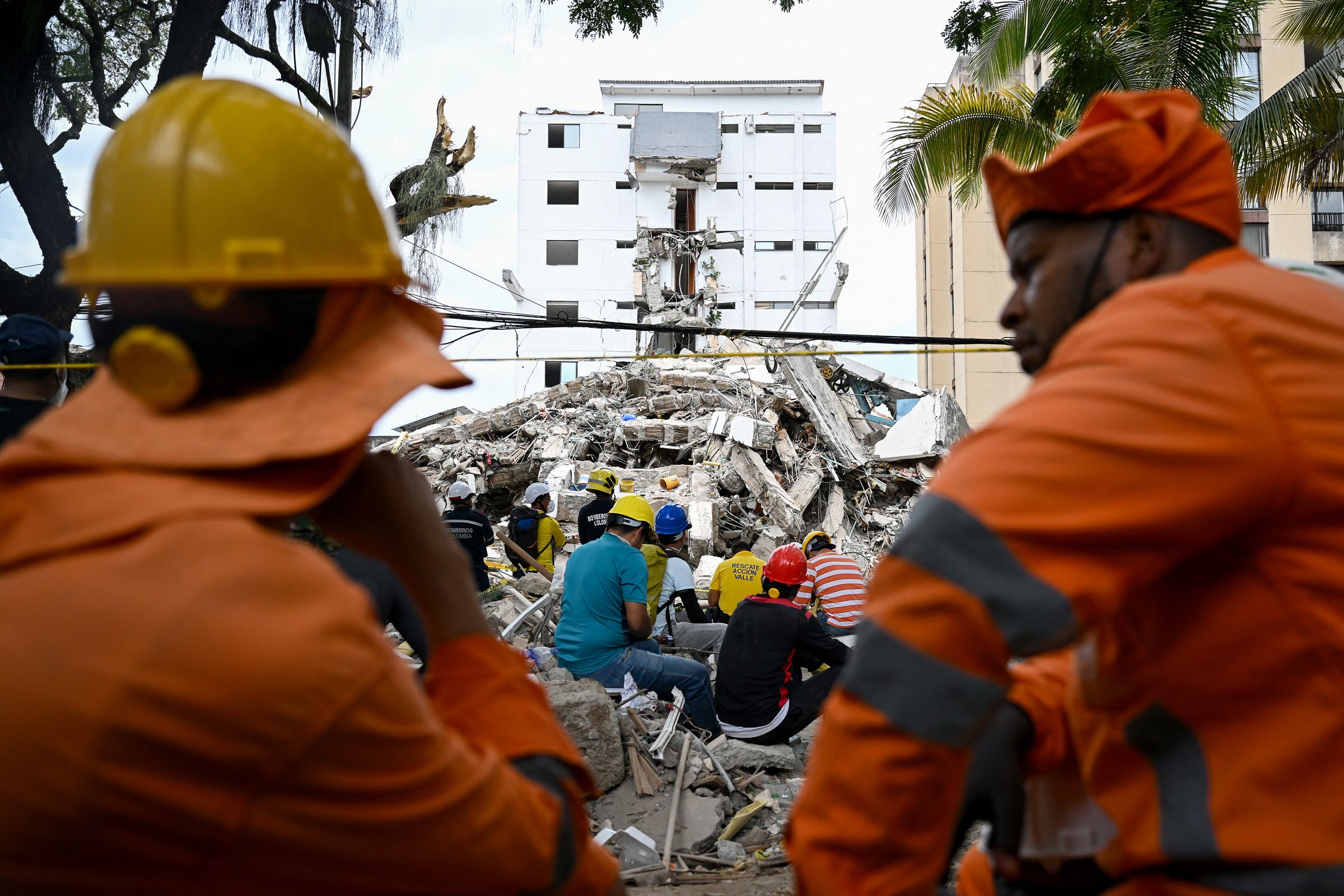 <i>Raul Arboleda/AFP/Getty Images via CNN Newsource</i><br/>Mexican rescuers take part in the search for survivors amid the rubble of a collapsed building following an earthquake in Cali