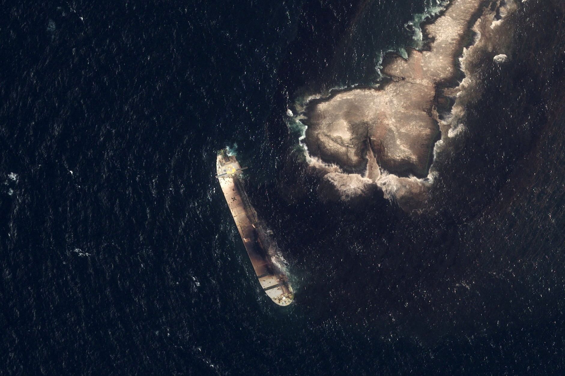<i>Ambrey via CNN Newsource</i><br/>The damaged and half sunk oil tanker Caroline Bezengi