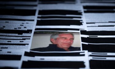 This photo illustration shows redacted documents from the Epstein Library files released by the US Department of Justice in Washington