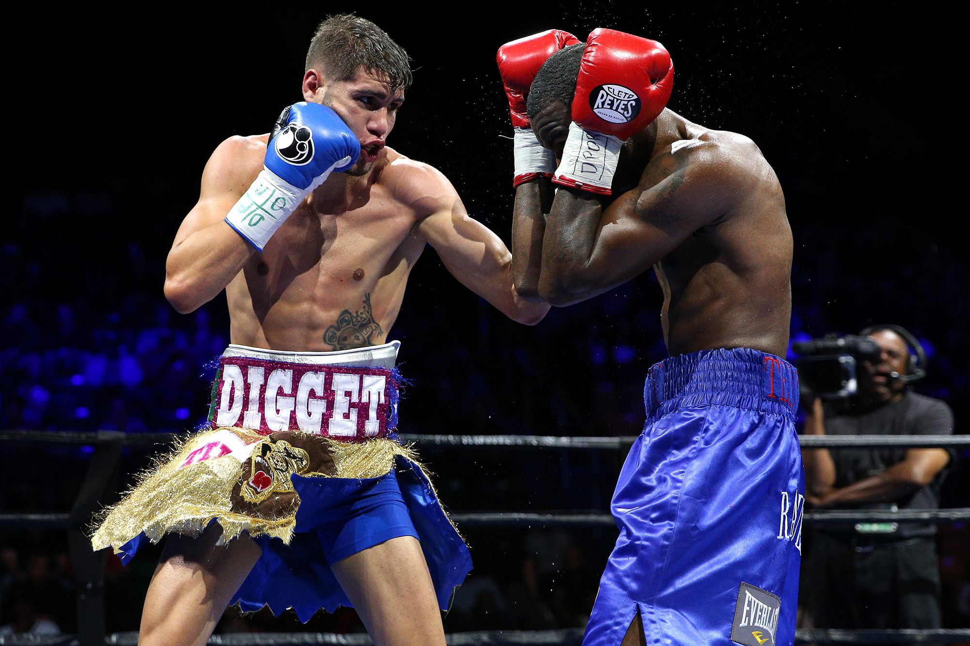 <i>Phelan M. Ebenhack/For The Washington Post/Getty Images via CNN Newsource</i><br/>Former professional boxer Prichard Colón is pushed in a wheelchair by his father