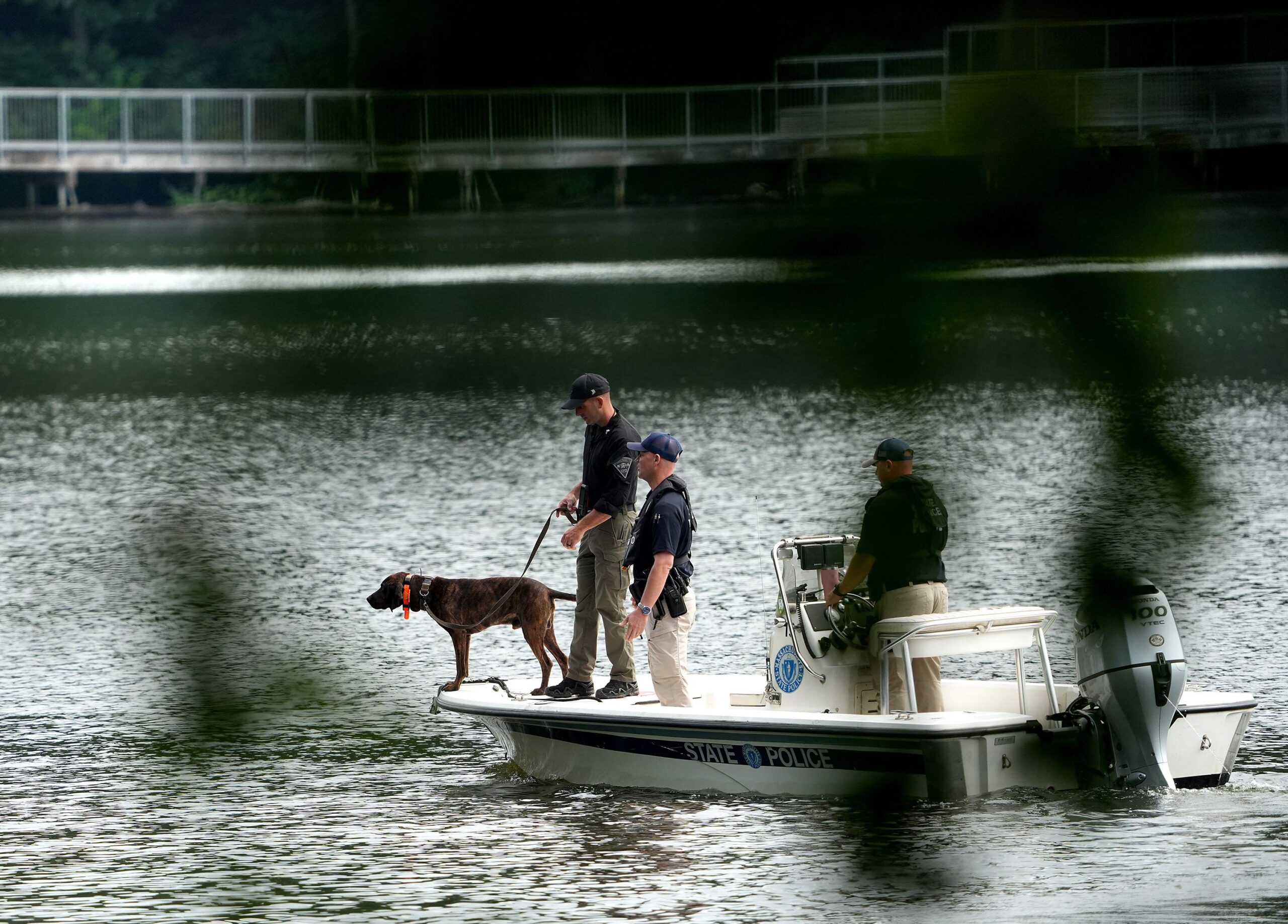 <i>Allan Jung/Telegram & Gazette/USA Today Network/Imagn Images via CNN Newsource</i><br/>A state police boat with a dog searches the waters of Coes Pond on Friday.