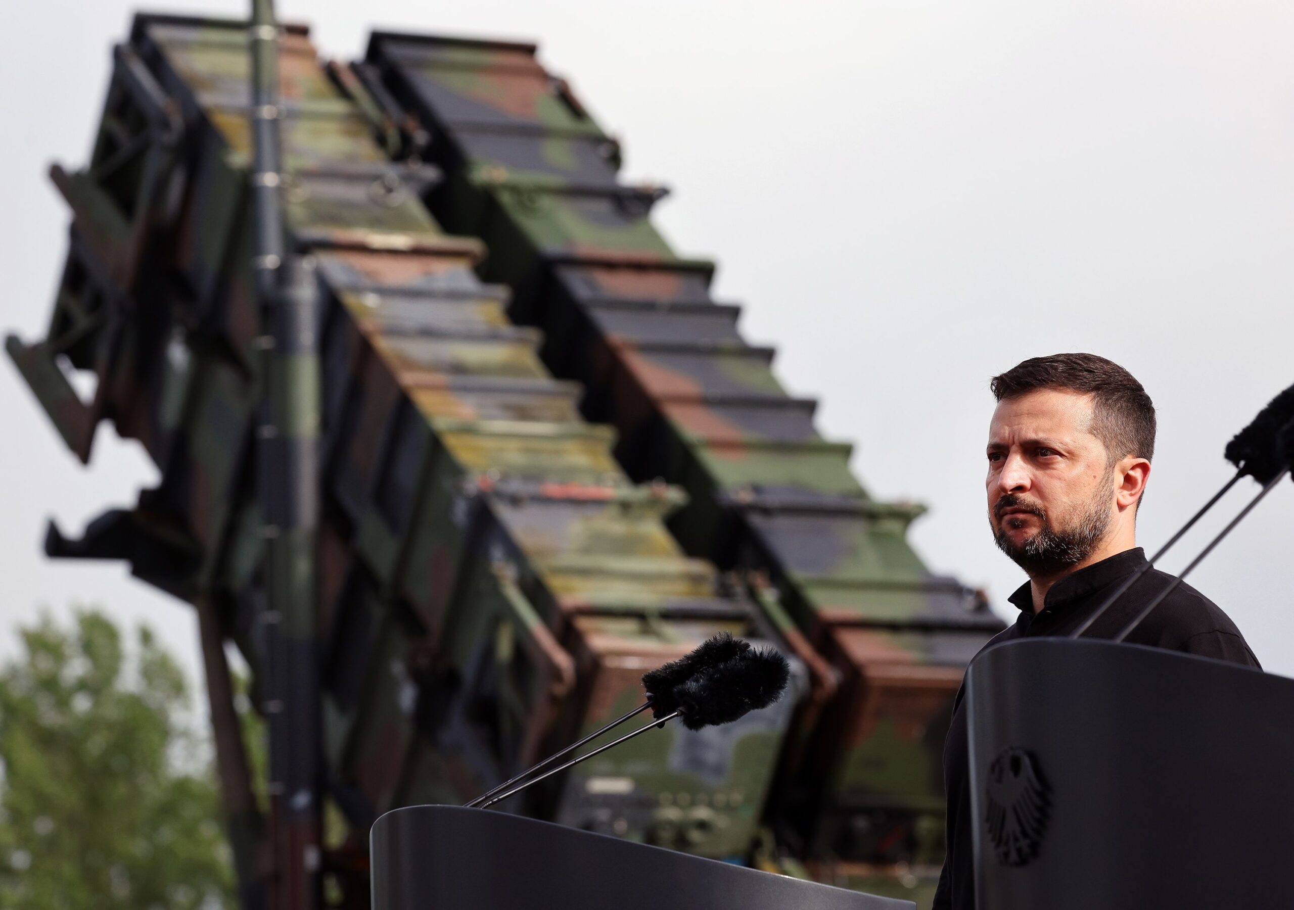 <i>Jens Büttner/Pool/Getty Images via CNN Newsource</i><br/>Volodymyr Zelensky stands in front of a Patriot anti-aircraft missile system during a visit to a military training area in Germany in 2024.