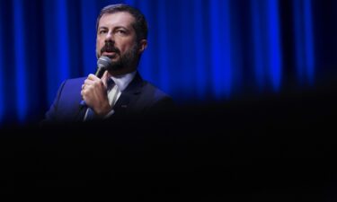 Former US Transportation Secretary Pete Buttigieg speaks during the Spratt Issues Conference at the Francis Marion University Performing Arts Center on August 22 in Florence