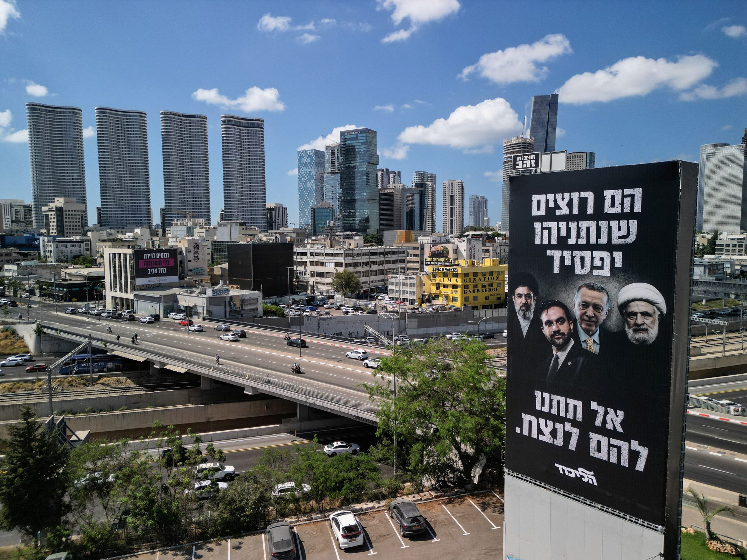 <i>Amir Cohen/Reuters via CNN Newsource</i><br/>A drone view of an election billboard by Benjamin Netanyahu's Likud Party depicting Iran's Supreme Leader Mojtaba Khamenei