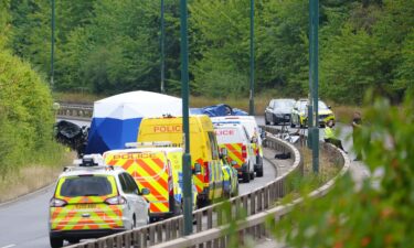 Police officers at the scene of a fatal crash involving a police car and a Volkswagen Passat on the A66 in South Bank
