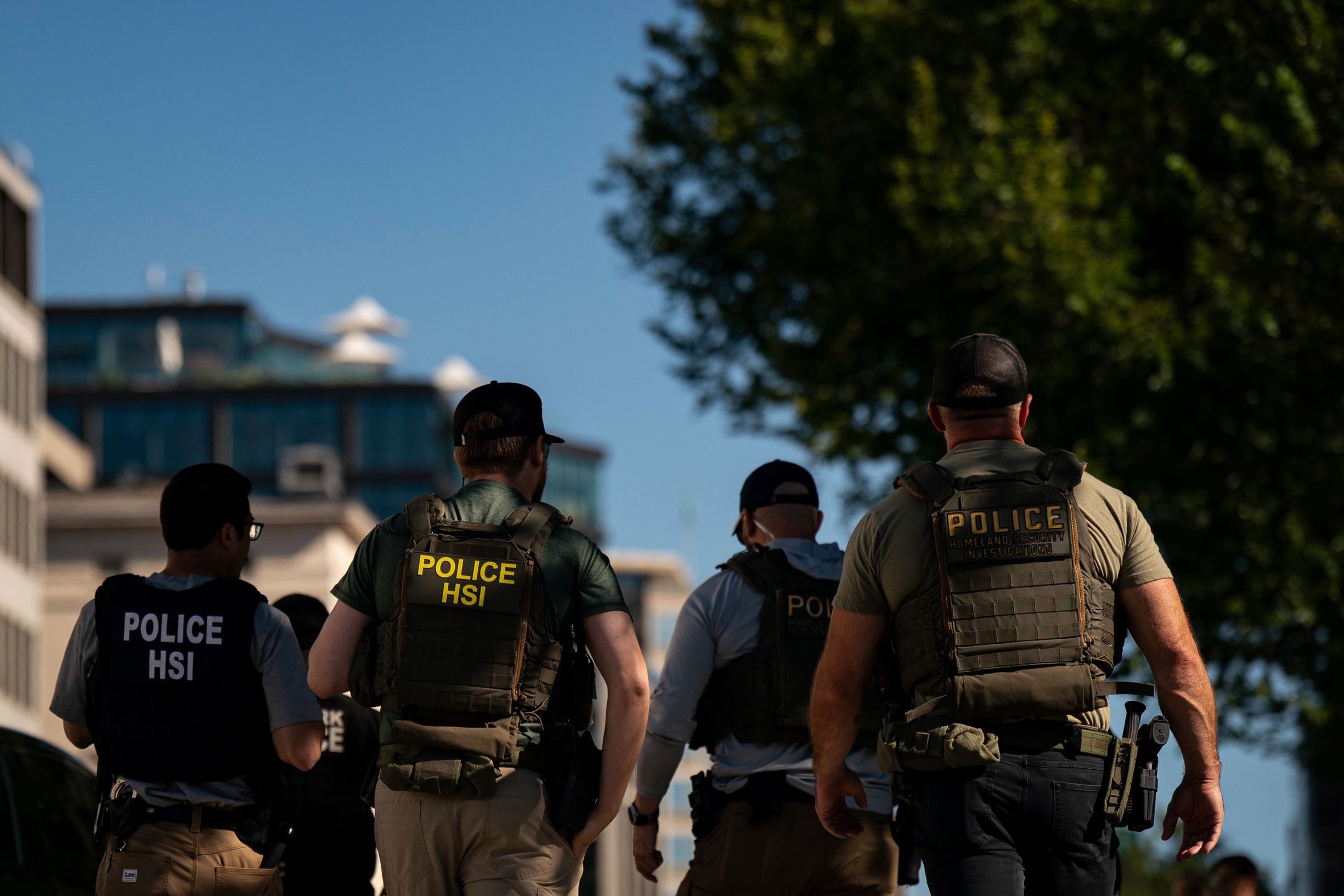<i>Al Drago/Bloomberg/Getty Images via CNN Newsource</i><br/>Agents from the US Immigration and Customs Enforcement's Homeland Security Investigations (HSI) unit are pictured during a traffic stop near the White House in Washington