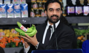 New York City Mayor Zohran Mamdani holds up bananas as he announced details of his plan to open five city-owned grocery stores on July 27 in the Brooklyn borough of New York City.