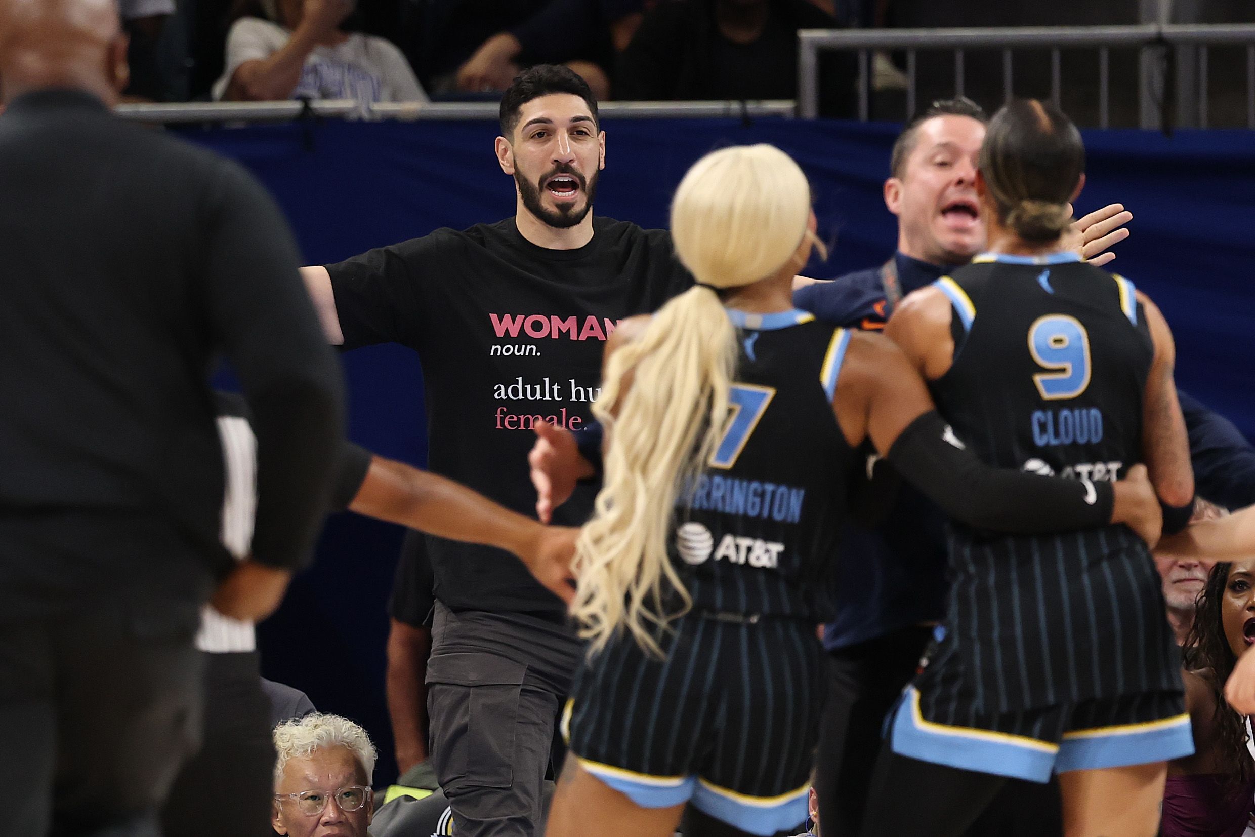 <i>Michael Reaves/Getty Images via CNN Newsource</i><br/>Former basketball player Enes Kanter Freedom and Natasha Cloud #9 of the Chicago Sky yell at one another during the Sky and Indiana Fever game on August 23.