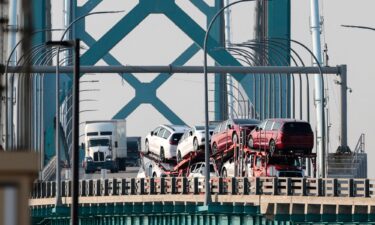 Trucks cross the Ambassador Bridge connecting Windsor