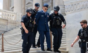 US Air Force Maj. Jason Watson was arrested by police on the Capitol steps after calling for the impeachment and removal of President Donald Trump