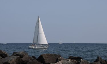A sailboat sails along Lake Ontario near Centre Island in Toronto