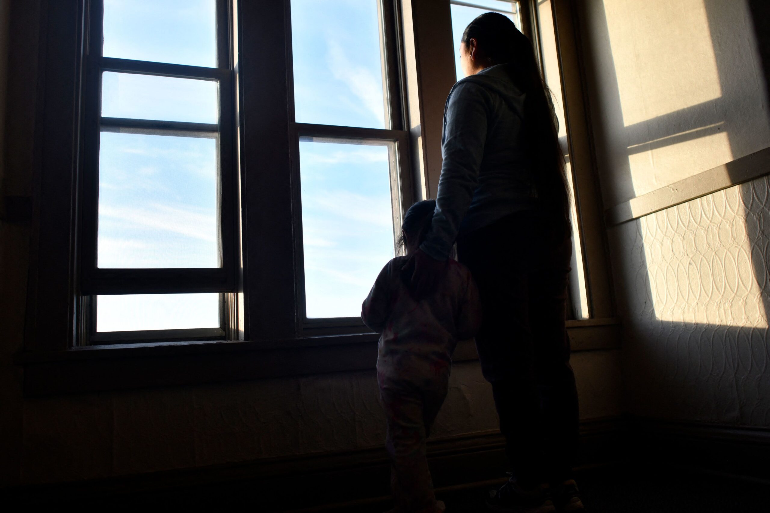 <i>Octavio Jones/AFP/Getty Images via CNN Newsource</i><br/>An asylum seeker poses for a photo with her daughter in Minneapolis in January.