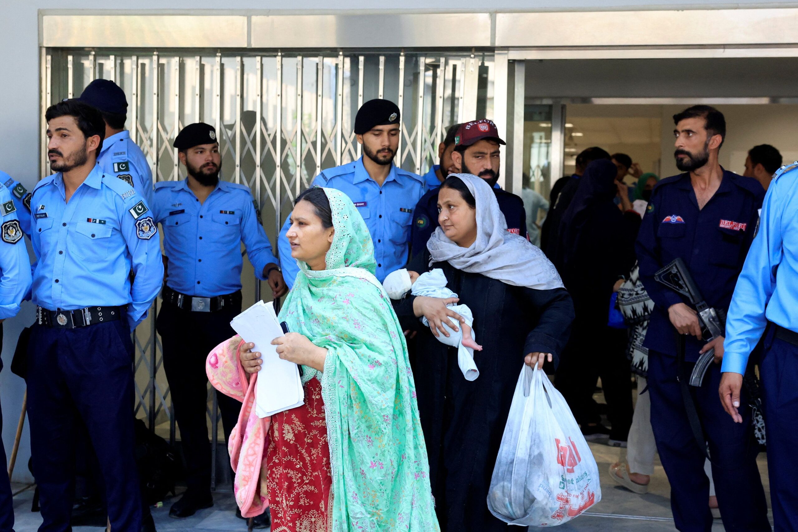 <i>Akhtar Soomro/Reuters via CNN Newsource</i><br/>A worker removes broken pieces of a glass window after a fire broke out at the Pakistan Institute of Medical Sciences (PIMS) hospital in Islamabad