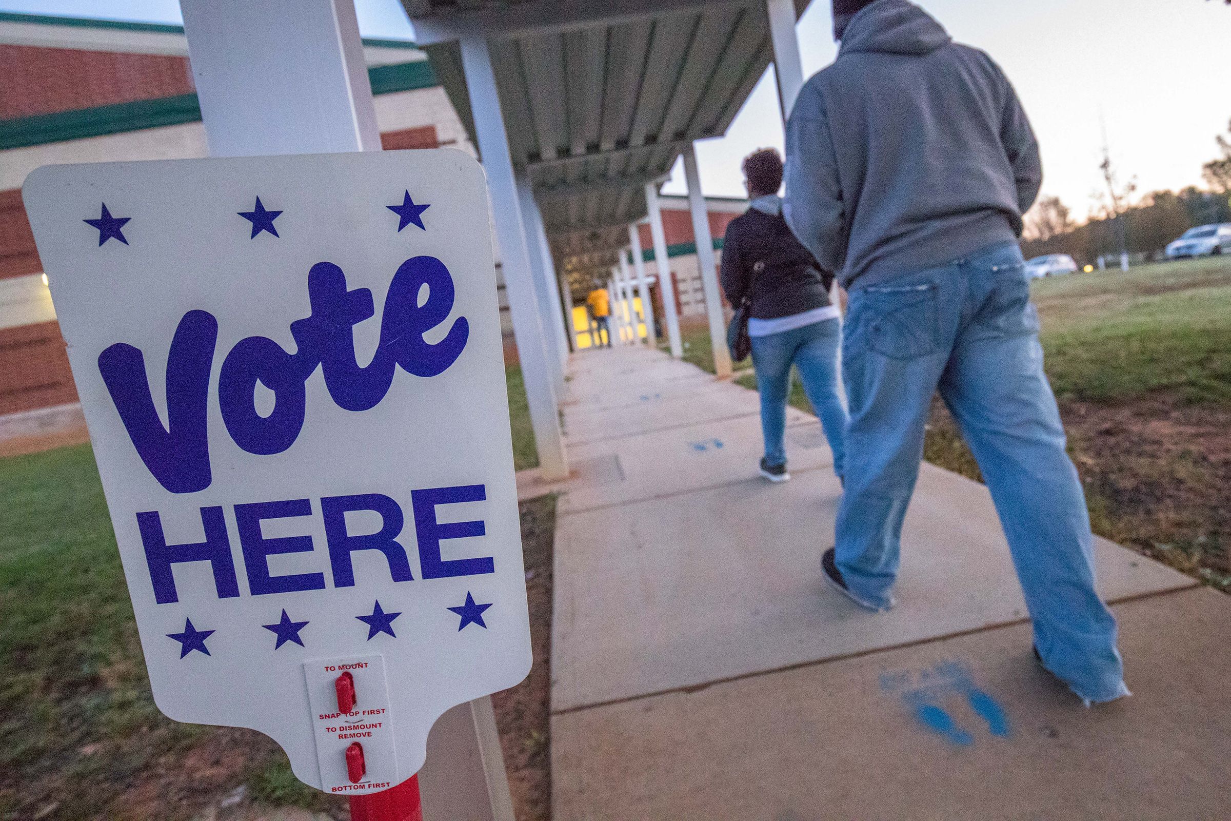 <i>Grant Baldwin/AFP/Getty Images via CNN Newsource</i><br/>People arrive to vote in Charlotte