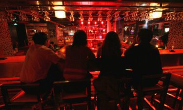 People drink at a bar in western China's Qinghai province last year.