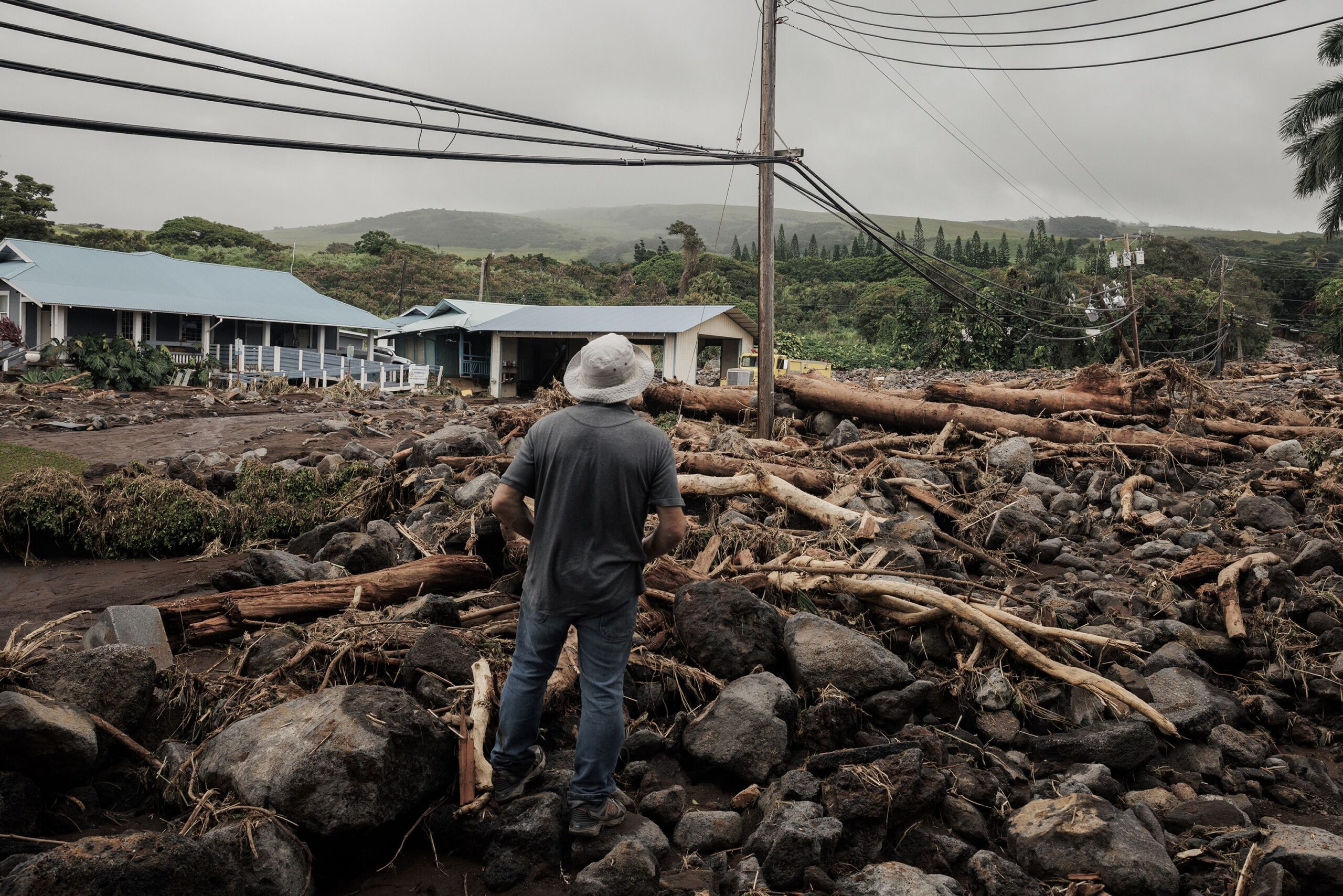 <i>Stephen Lam/San Francisco Chronicle/Getty Images via CNN Newsource</i><br/>A man watches debris flow along Ka'alaiki Road after Hurricane Lala in Naalehu