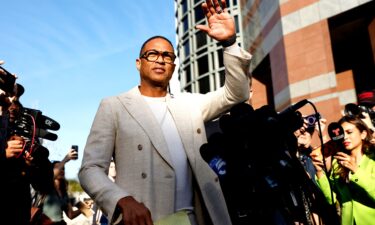 Journalist Don Lemon waves outside federal court on January 30