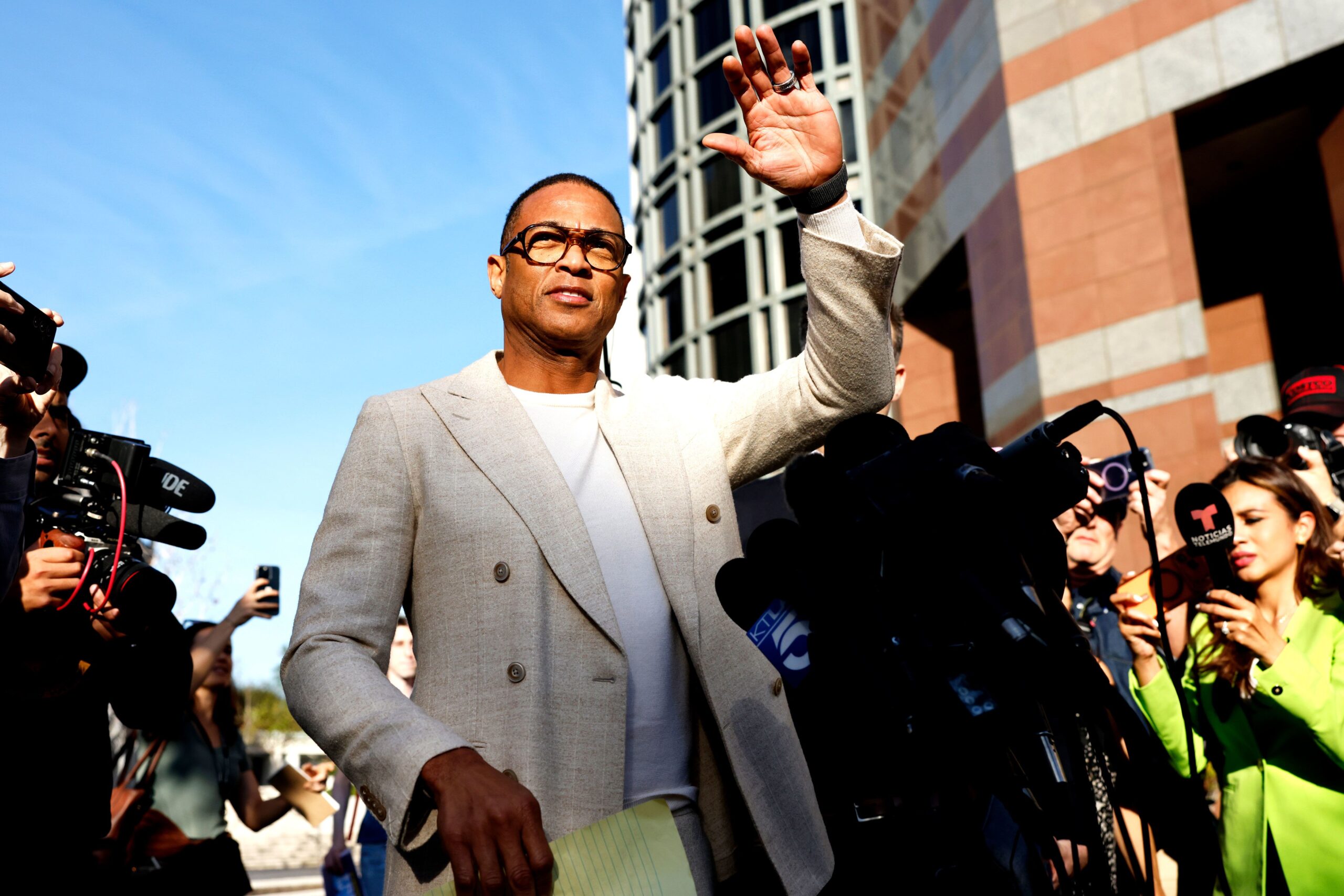 <i>Mario Tama/Getty Images via CNN Newsource</i><br/>Journalist Don Lemon waves outside federal court on January 30