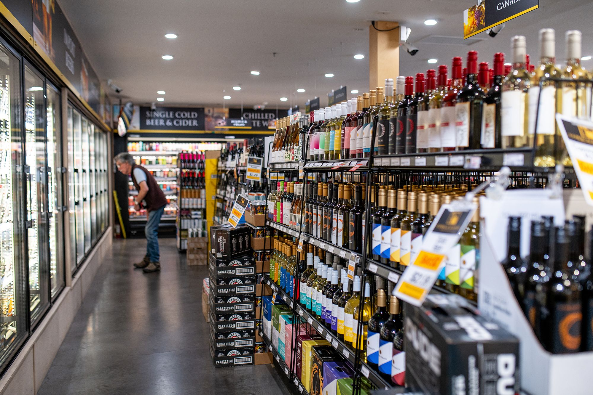 <i>James MacDonald/Bloomberg/Getty Images via CNN Newsource</i><br/>Shelves of wine at a liquor store in Victoria